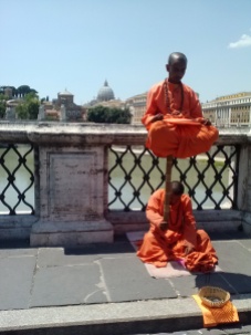 Monks meditating on the Tiber River.